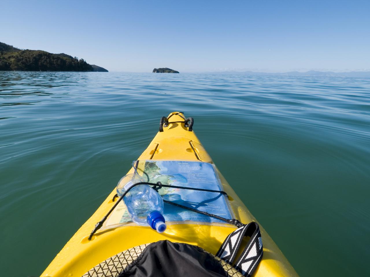 Paddling with the current a group of kayakers